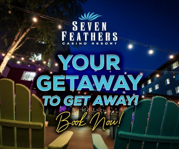 Nighttime casino resort advertisement: “SEVEN FEATHERS CASINO RESORT” “YOUR GETAWAY” “Book Now!”